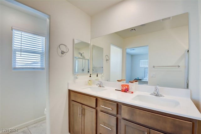 bathroom featuring tile patterned flooring, vanity, and toilet