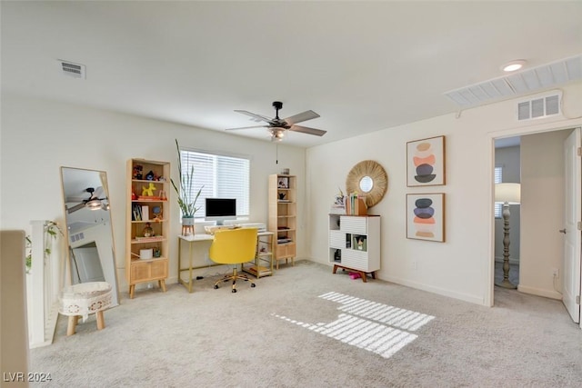 carpeted home office with ceiling fan