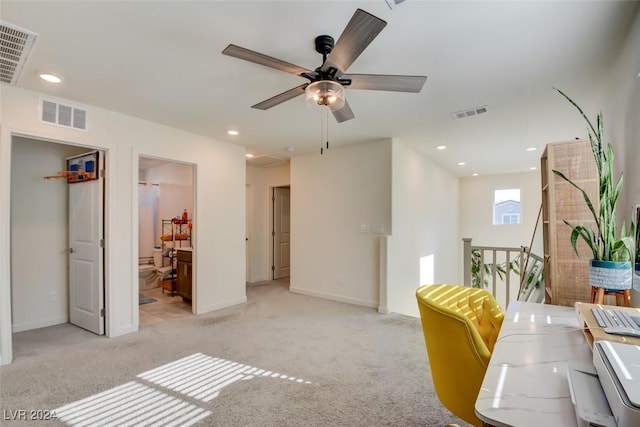 interior space with light carpet and ceiling fan