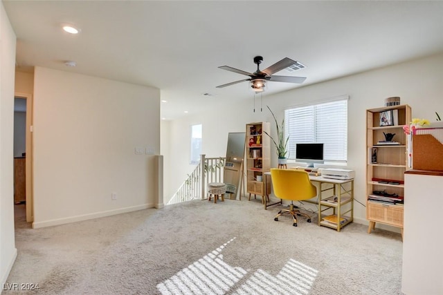 home office with ceiling fan and light colored carpet