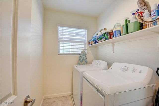 laundry area featuring independent washer and dryer and light tile patterned floors