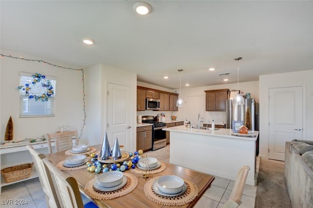 tiled dining room with sink