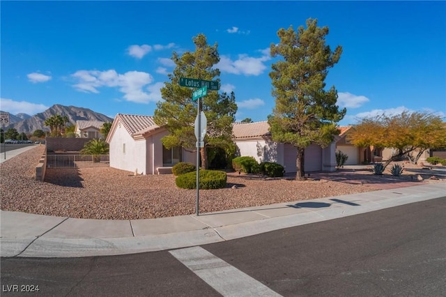 view of front of house featuring a mountain view and a garage