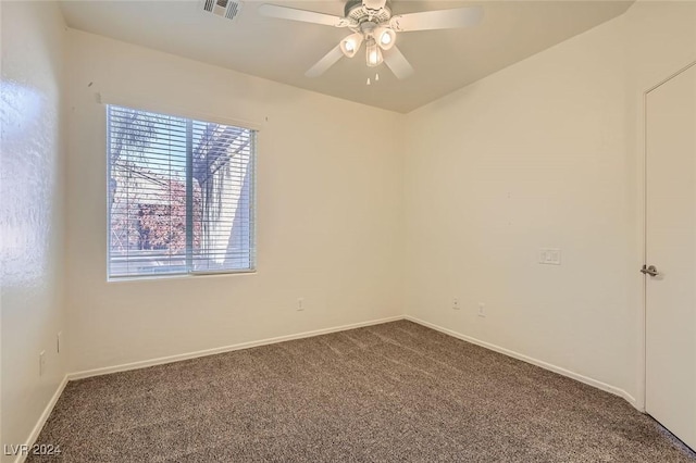 carpeted empty room featuring ceiling fan