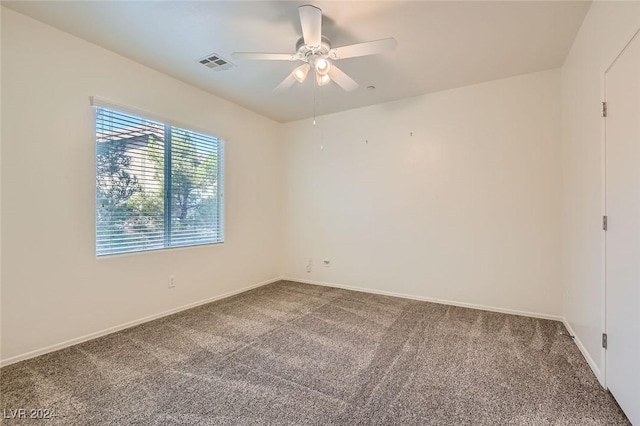 empty room featuring ceiling fan and carpet floors