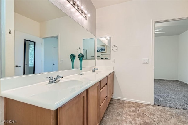 bathroom with ceiling fan, tile patterned flooring, and vanity