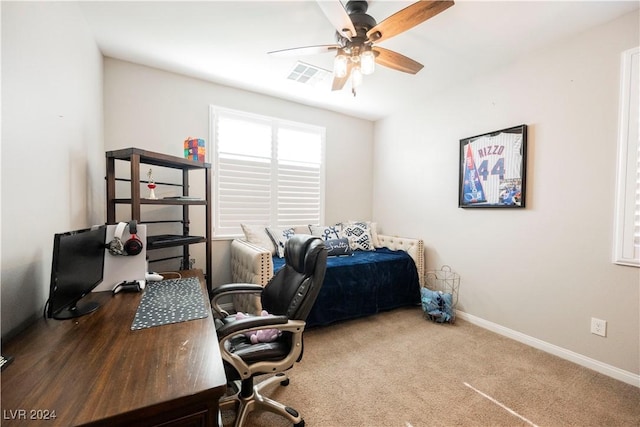 office area with ceiling fan and carpet