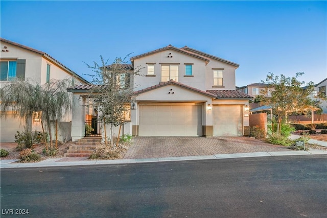 mediterranean / spanish-style house featuring a garage