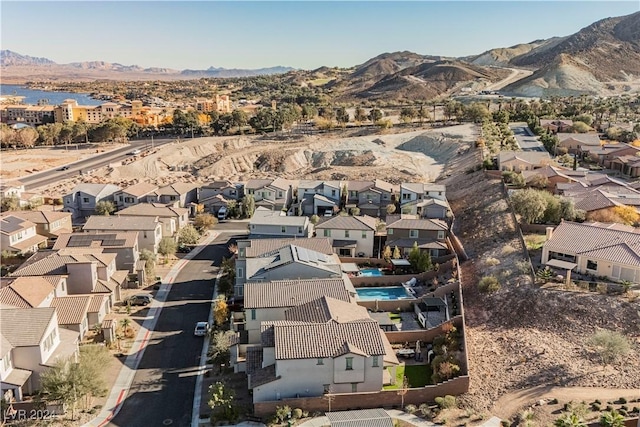 birds eye view of property with a mountain view