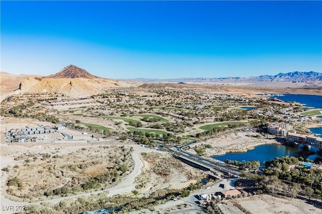 birds eye view of property featuring a water and mountain view