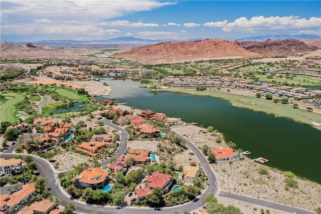 drone / aerial view with a water and mountain view