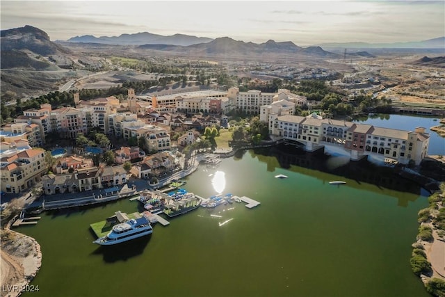 drone / aerial view featuring a water and mountain view