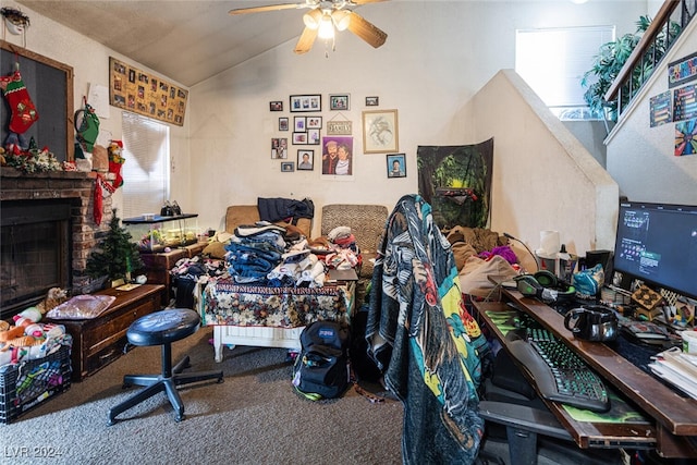 interior space featuring carpet flooring, vaulted ceiling, ceiling fan, and a fireplace