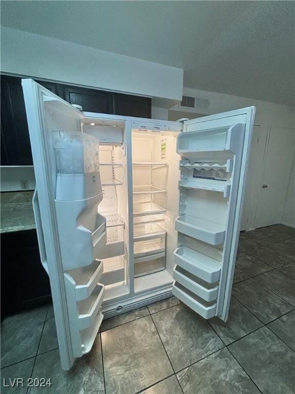 interior details featuring fridge