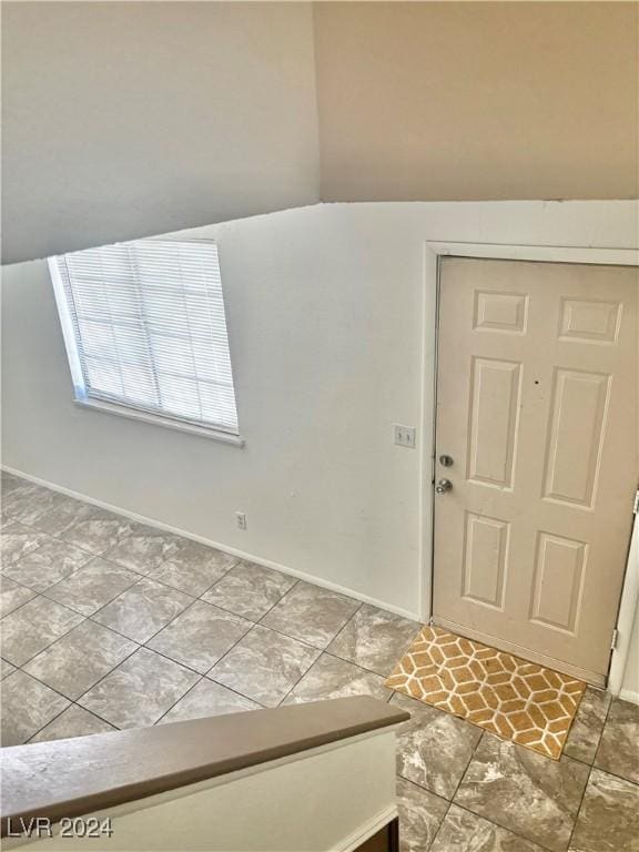 foyer with lofted ceiling