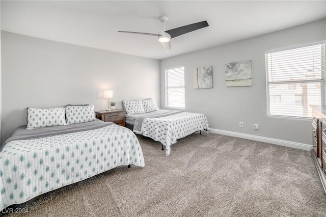 bedroom with ceiling fan and carpet floors