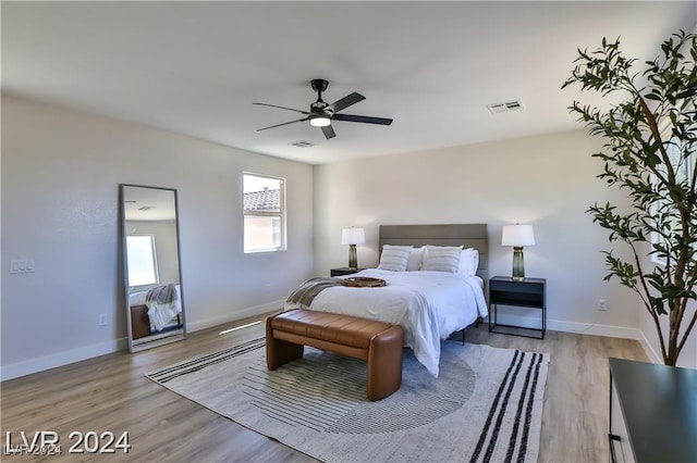 bedroom with light wood-type flooring and ceiling fan