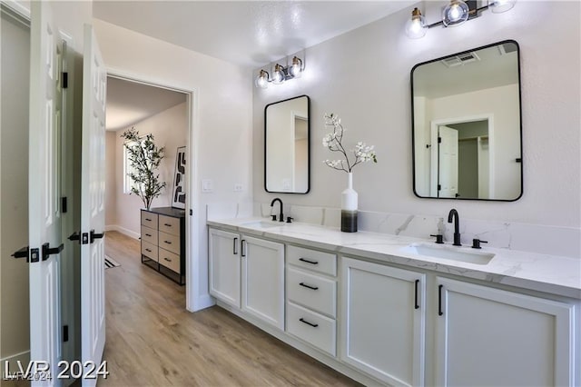 bathroom featuring vanity and hardwood / wood-style flooring