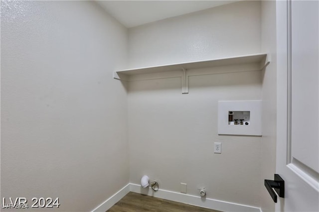 laundry room with washer hookup, hookup for a gas dryer, and dark wood-type flooring