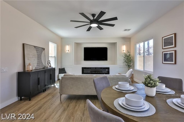 dining space featuring ceiling fan and hardwood / wood-style floors