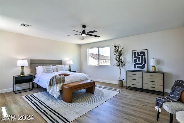 bedroom featuring hardwood / wood-style floors and ceiling fan