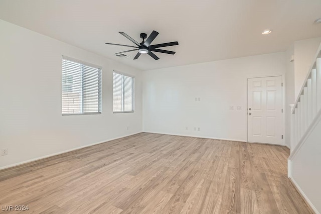 unfurnished room featuring ceiling fan and light hardwood / wood-style floors