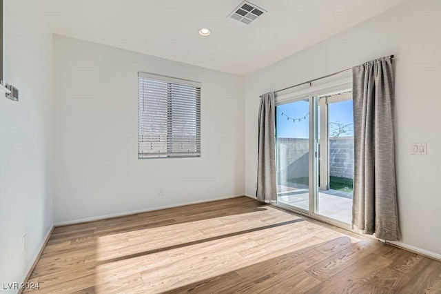 spare room featuring light wood-type flooring