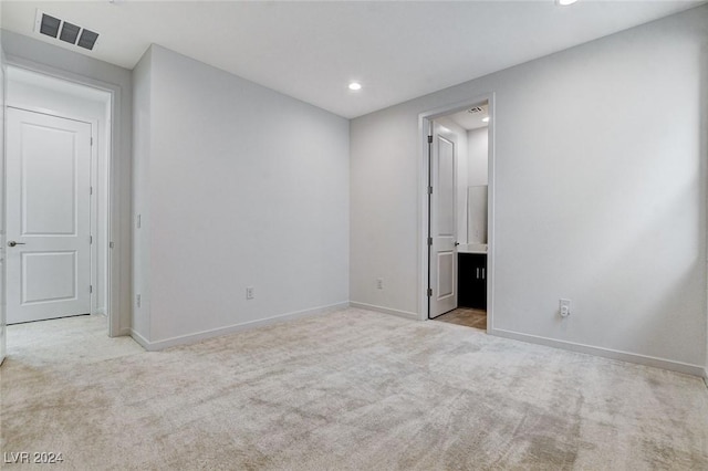 unfurnished bedroom with baseboards, visible vents, and carpet flooring