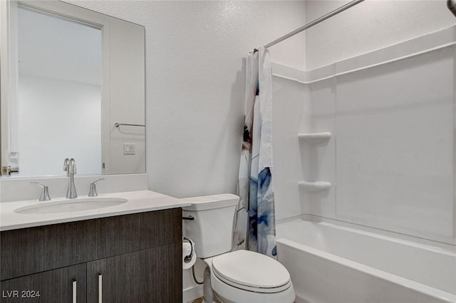 bathroom featuring toilet, a textured wall, vanity, and shower / tub combo with curtain