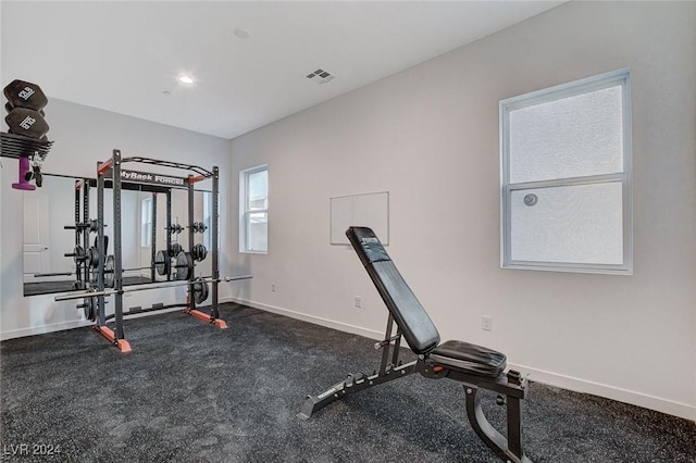 exercise area with visible vents and baseboards