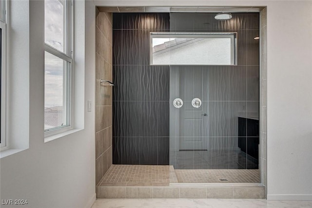 bathroom featuring baseboards and a walk in shower