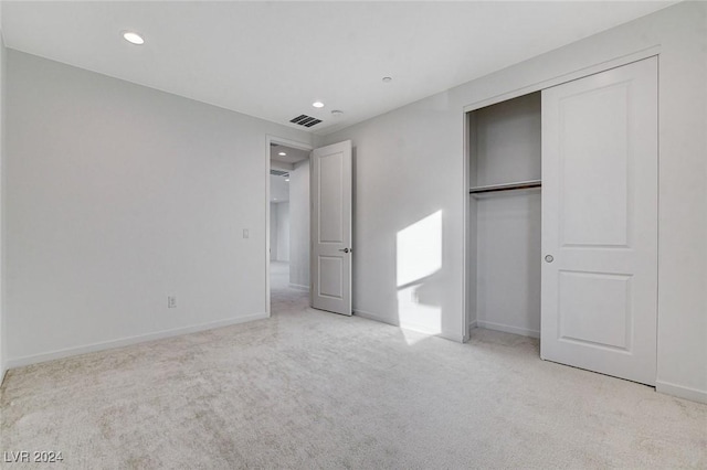 unfurnished bedroom featuring carpet, visible vents, baseboards, and recessed lighting