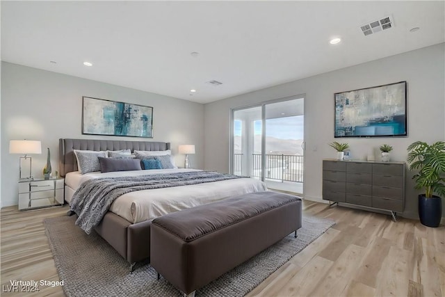 bedroom with light wood finished floors, access to outside, visible vents, and recessed lighting