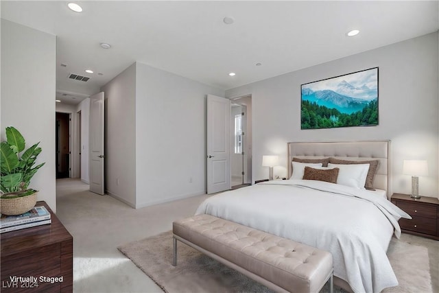 bedroom featuring light carpet, visible vents, and recessed lighting