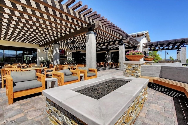 view of patio featuring outdoor dining space and a fire pit