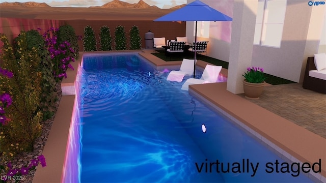 view of pool with a patio area and a fenced in pool