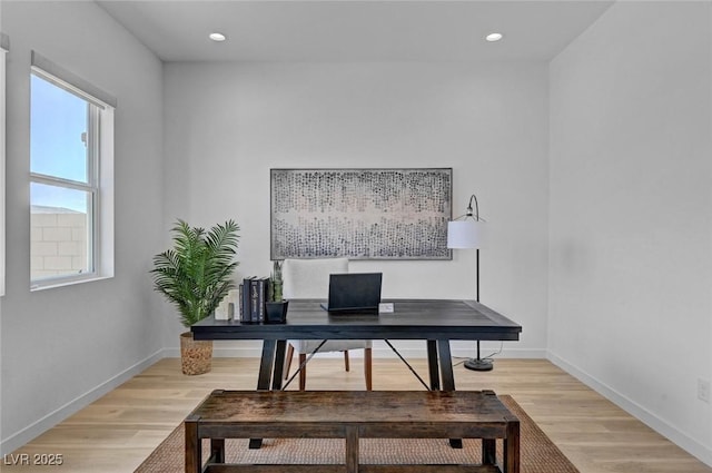 office space with recessed lighting, light wood-style flooring, and baseboards