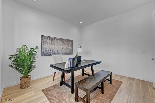 office space with light wood-type flooring, baseboards, and recessed lighting