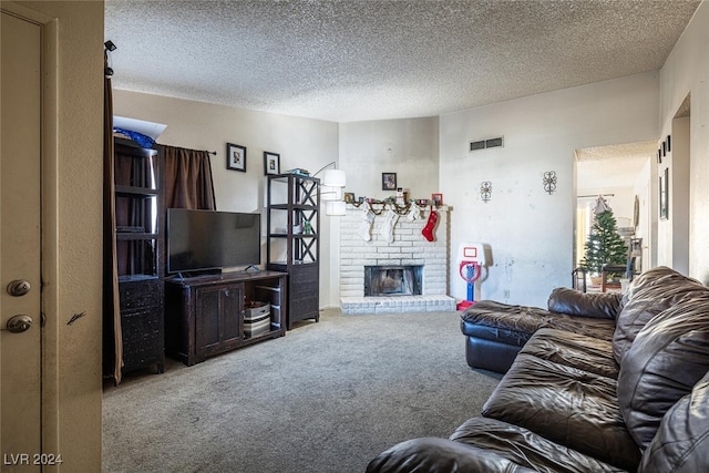 living room featuring carpet and a textured ceiling