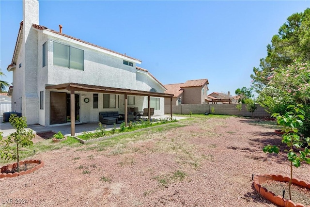 rear view of house featuring a patio