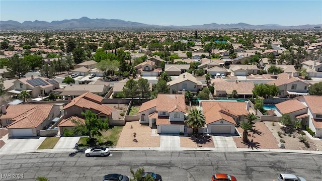 birds eye view of property featuring a mountain view