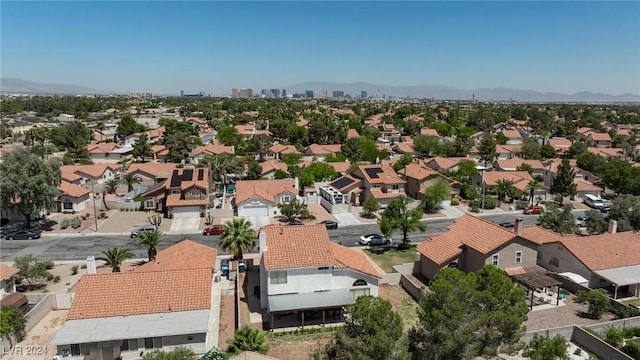 birds eye view of property featuring a mountain view