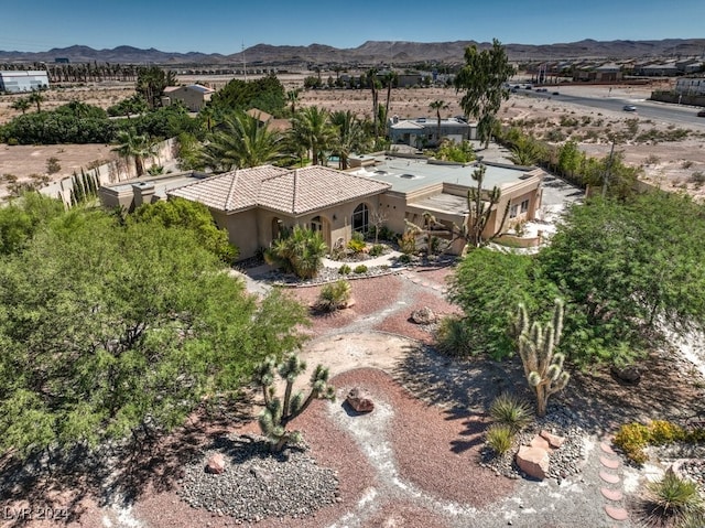 birds eye view of property featuring a mountain view