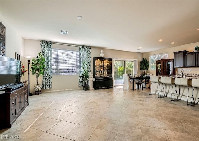 living room with light tile patterned flooring