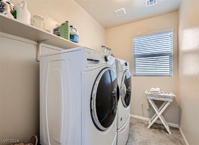 washroom with washer and clothes dryer