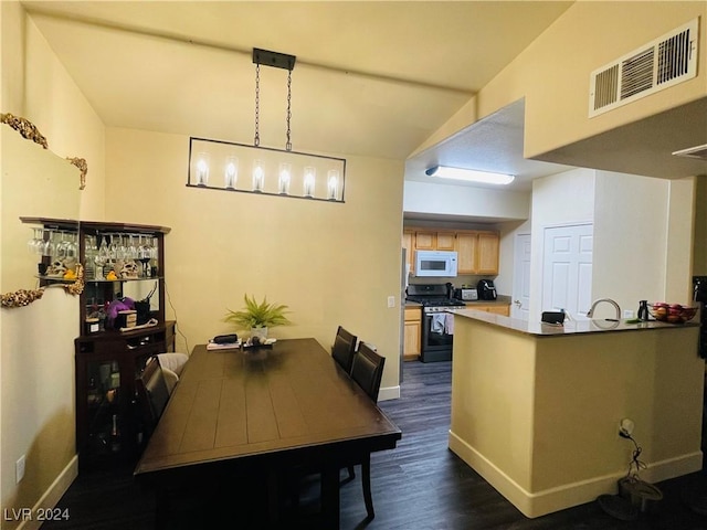 dining room with dark wood-type flooring