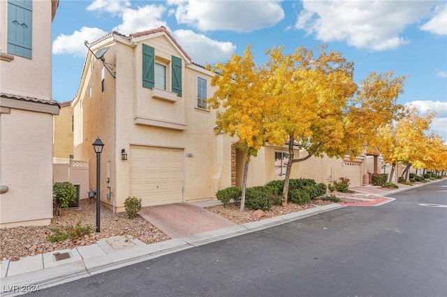 view of front of property with a garage