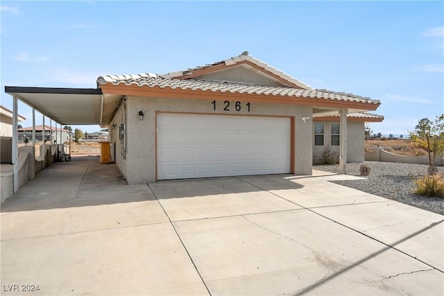 view of front of property featuring a carport