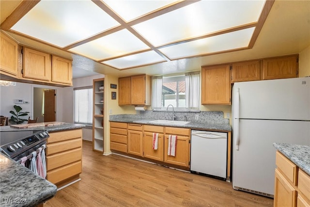 kitchen featuring sink, white appliances, and light wood-type flooring