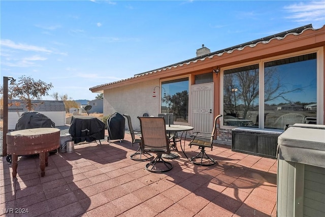 wooden terrace featuring a patio